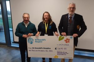 Phillip Peacock (Chairman of Ponteland 41 Club), Danielle Harvey (St Oswald’s Hospice) and David Comeskey (President of Ponteland Rugby Club)