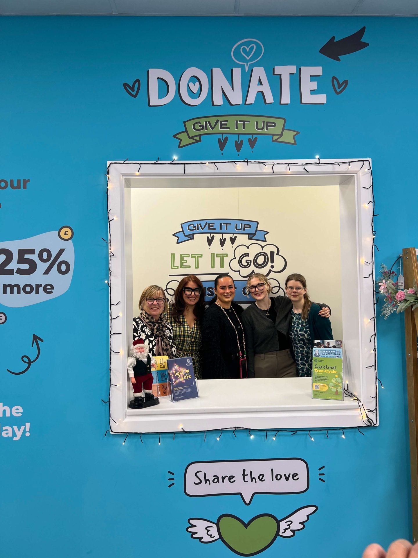 St Oswald's Hospice shop staff in donation hatch